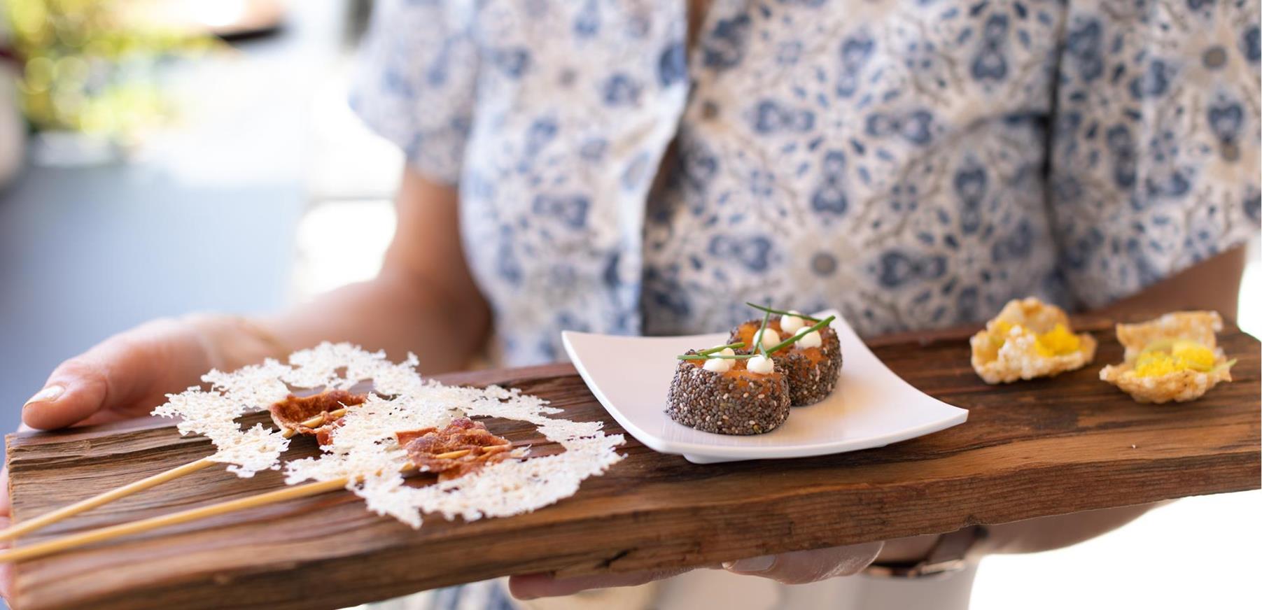 A waitress serves the starters