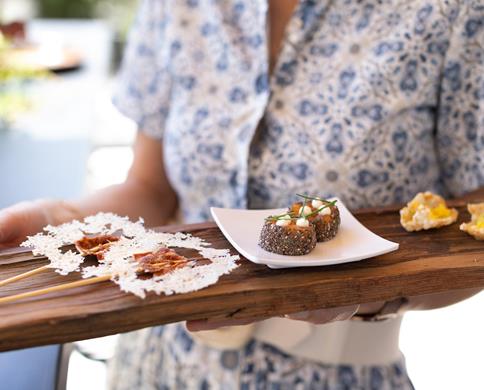 A waitress serves the starters