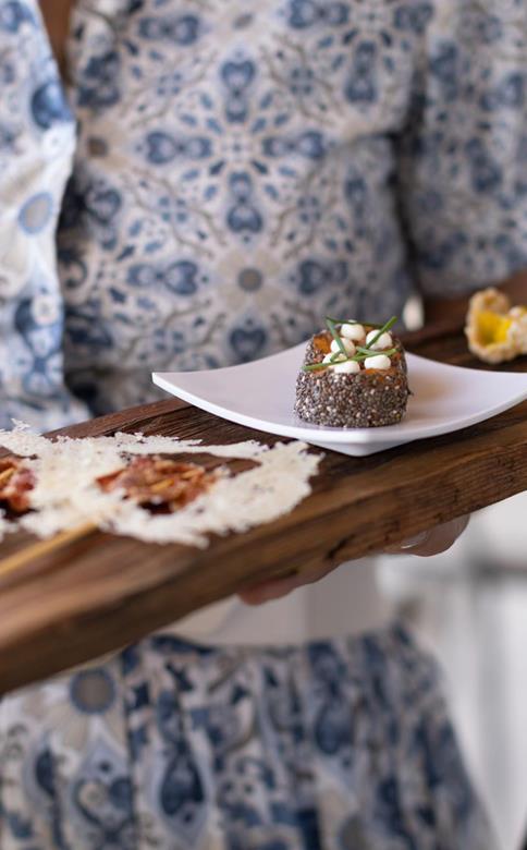 A waitress serves the starters