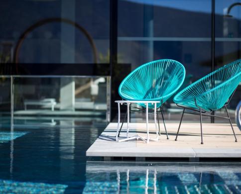 Blue chairs at the poolside