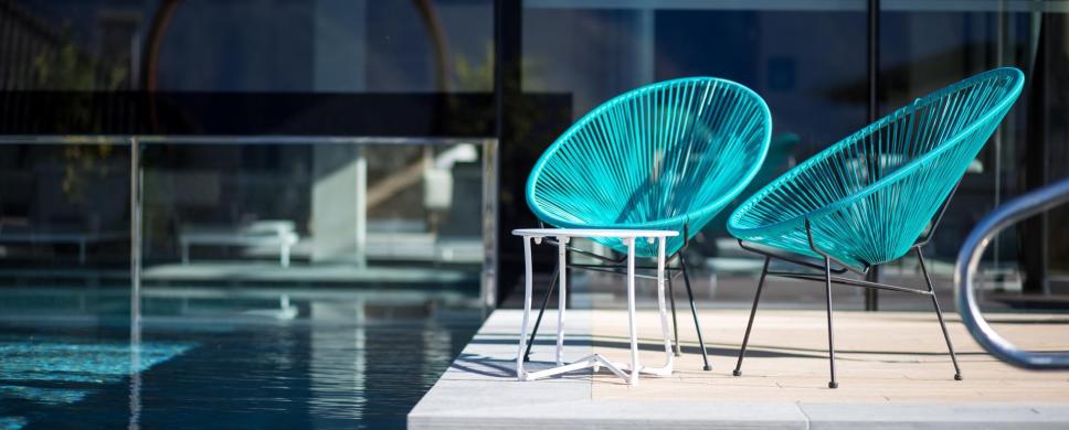 Blue chairs at the poolside