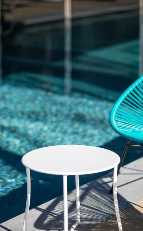 Blue chairs at the poolside